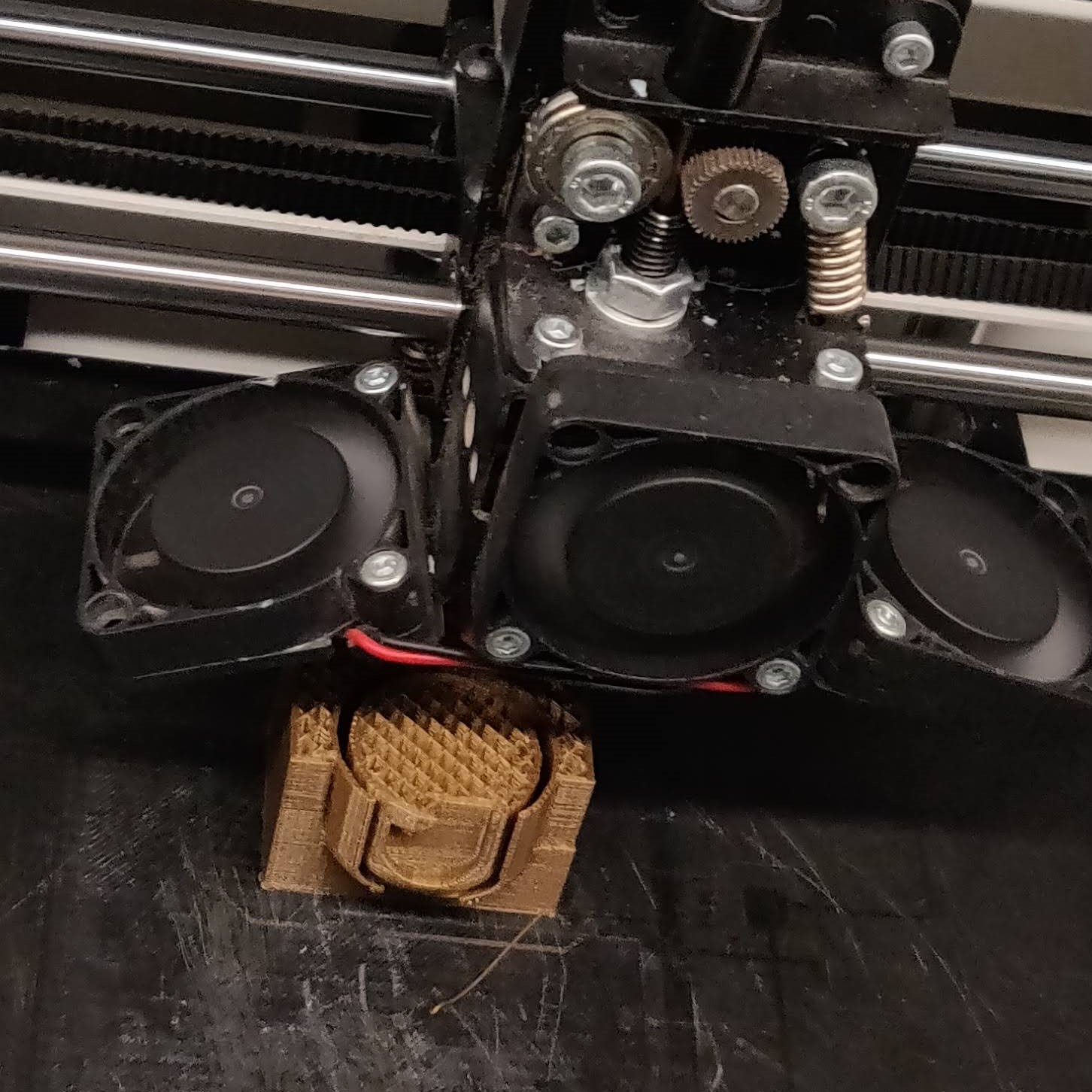 Perfecting the eye design involved tests in finding what spacing & minimal support was needed for a successful print where the eye could move freely in good form